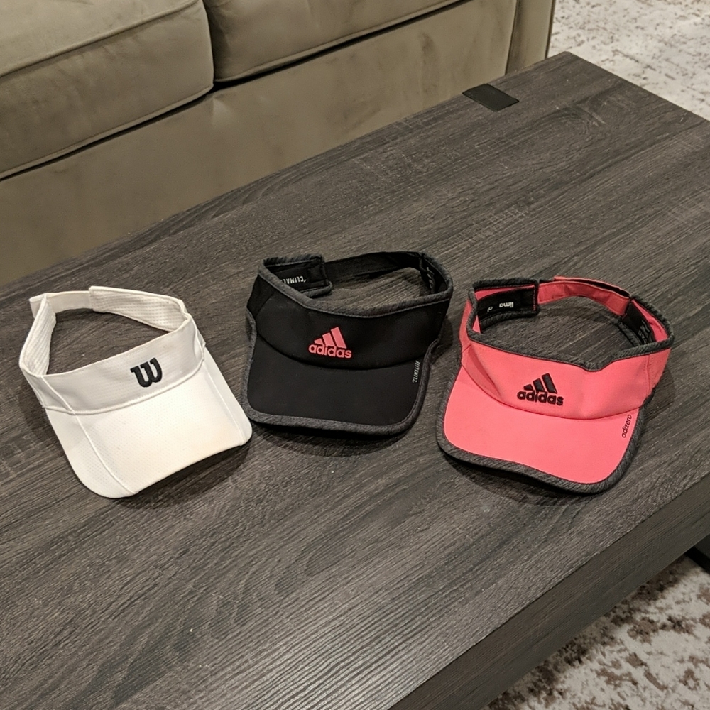 3 Ladies visors. Black and pink are adidas and wh